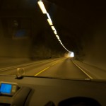 on the road, passing one of many tunnels